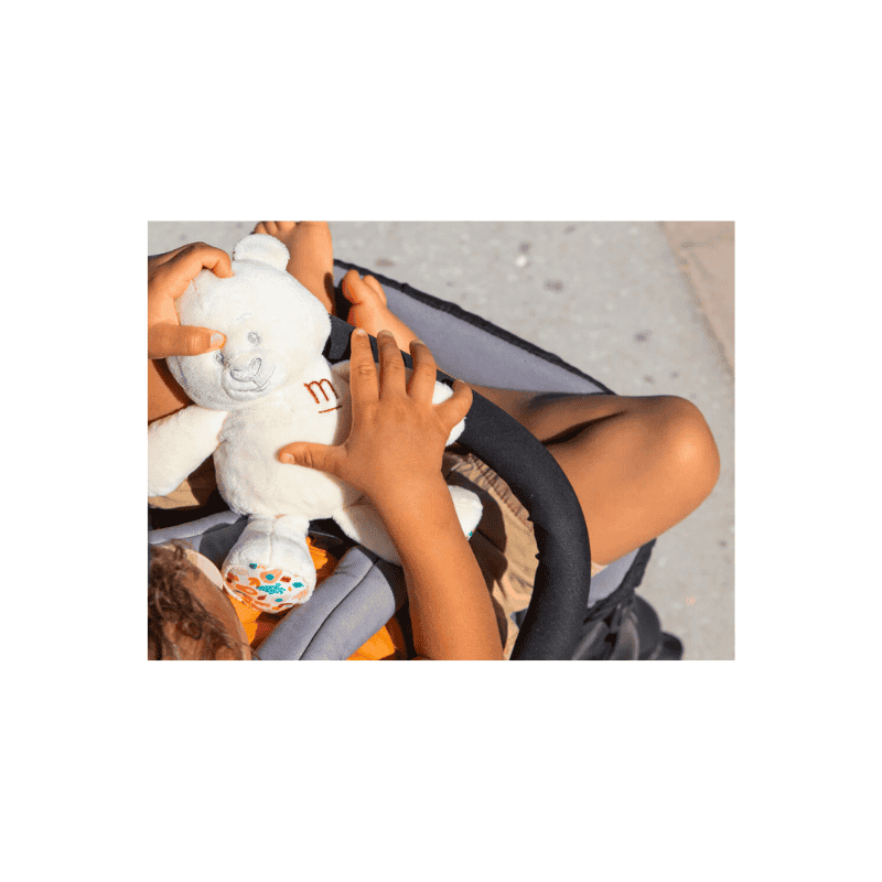 mustela musti baby perfume gift set lifestyle image (baby holding toy)